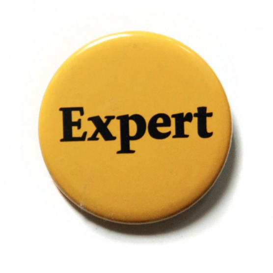 Yellow button with "Expert" in black letters for exfed dog training's expert package